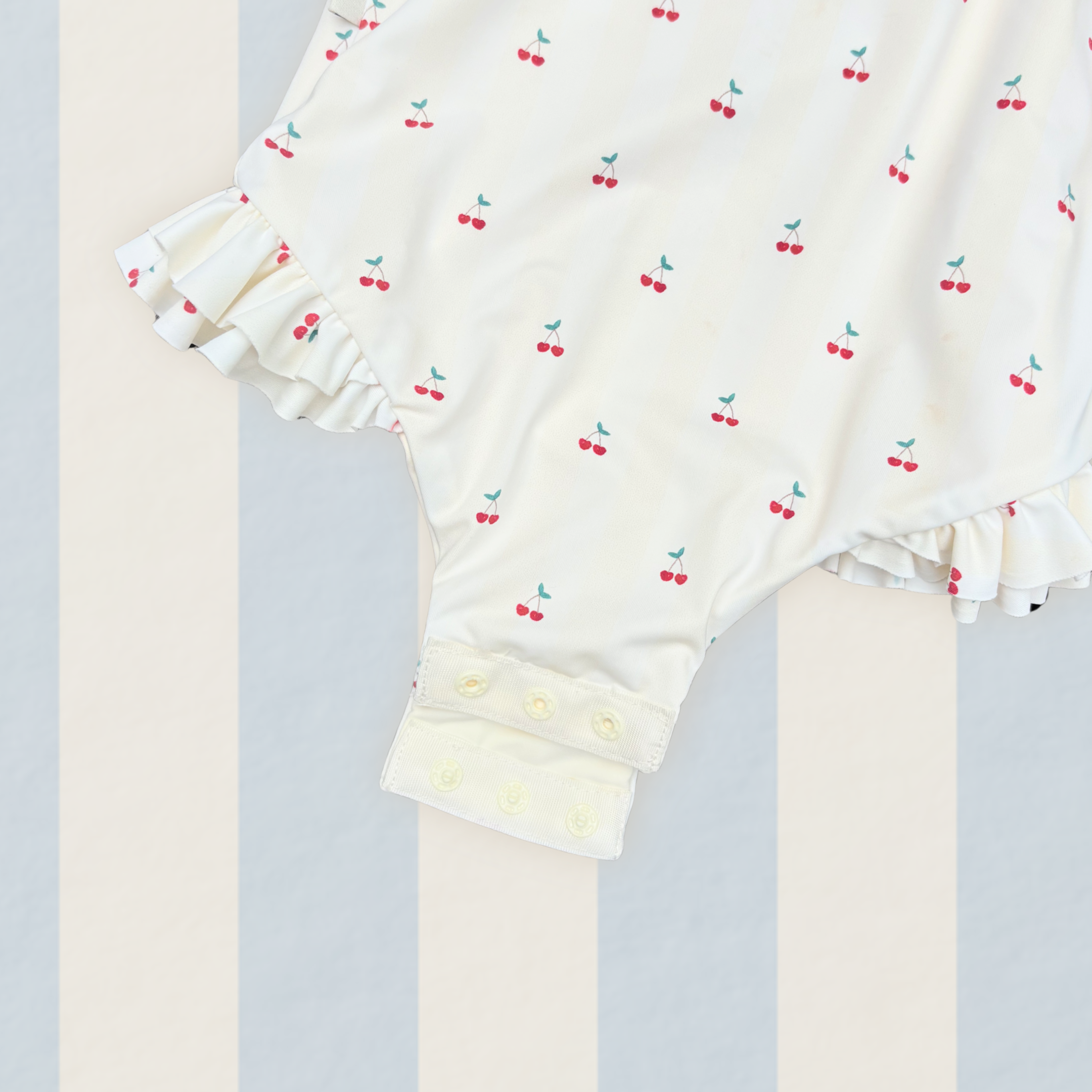 Girls one piece swimsuit hand-painted cherry pattern on yellow stripes UPF50+ yellow red green cream. double leg frills and self tie bow straps