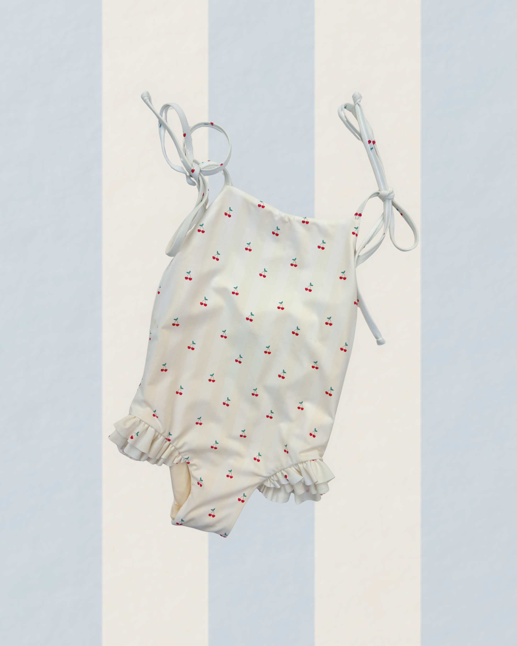 Girls one piece swimsuit hand-painted cherry pattern on yellow stripes UPF50+ yellow red green cream. double leg frills and self tie bow straps